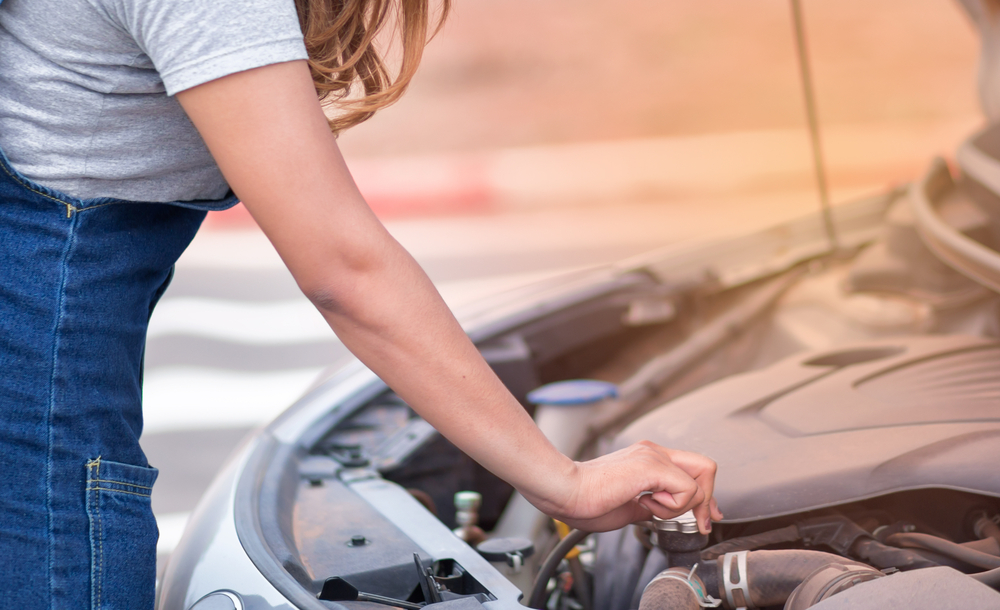 Closeup,Young,Woman,Reparing,The,Car,Under,The,Hood.,Broken