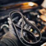 Automotive,Timing,Belt,In,The,Hand,Of,An,Auto,Mechanic.