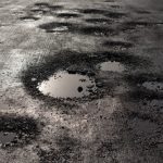 Potholes,In,The,Road,Looking,Like,Alien,Craters